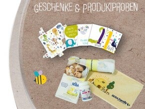 Baby care items, a booklet, and a cloth on textured background.